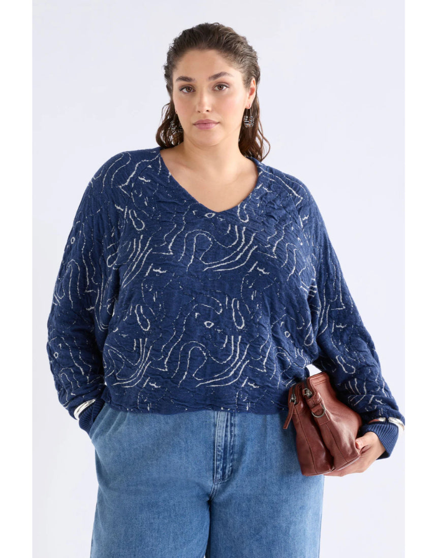 Elk Otillia sweater in blue and silver, showcasing a cozy knit fabric with a relaxed fit and stylish design.