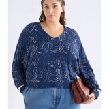 Elk Otillia sweater in blue and silver, showcasing a cozy knit fabric with a relaxed fit and stylish design.