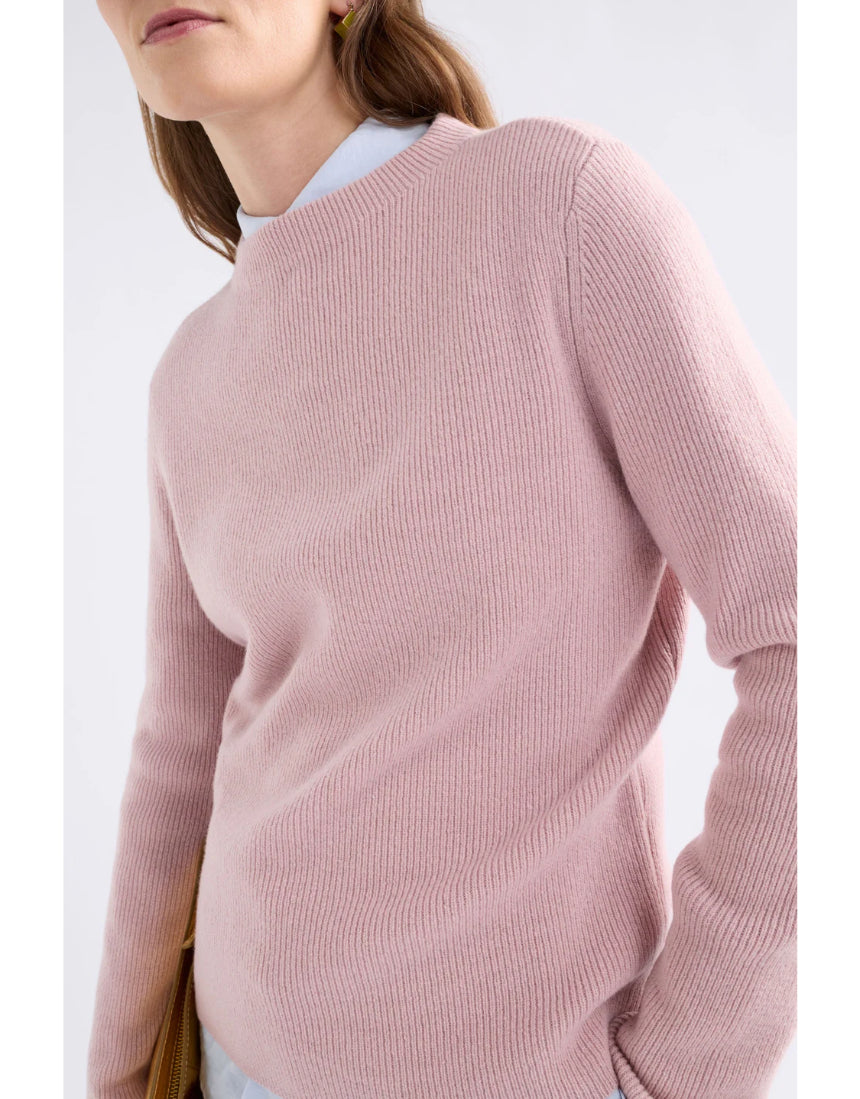 Elk Nevis Merino Sweater in blush pink, featuring a cozy knit design and ribbed cuffs, perfect for comfortable winter wear.