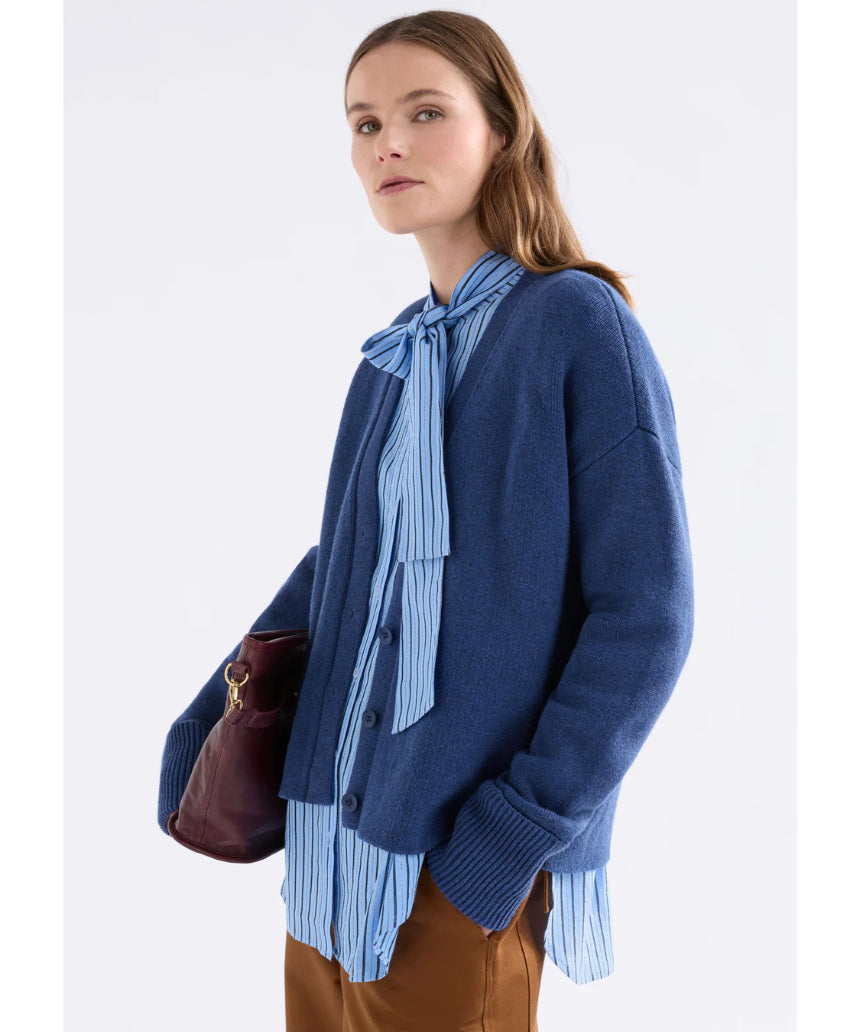 Elk Klee Cardi in bright navy, a stylish knitted clothing item with a textured pattern, shown on a model.