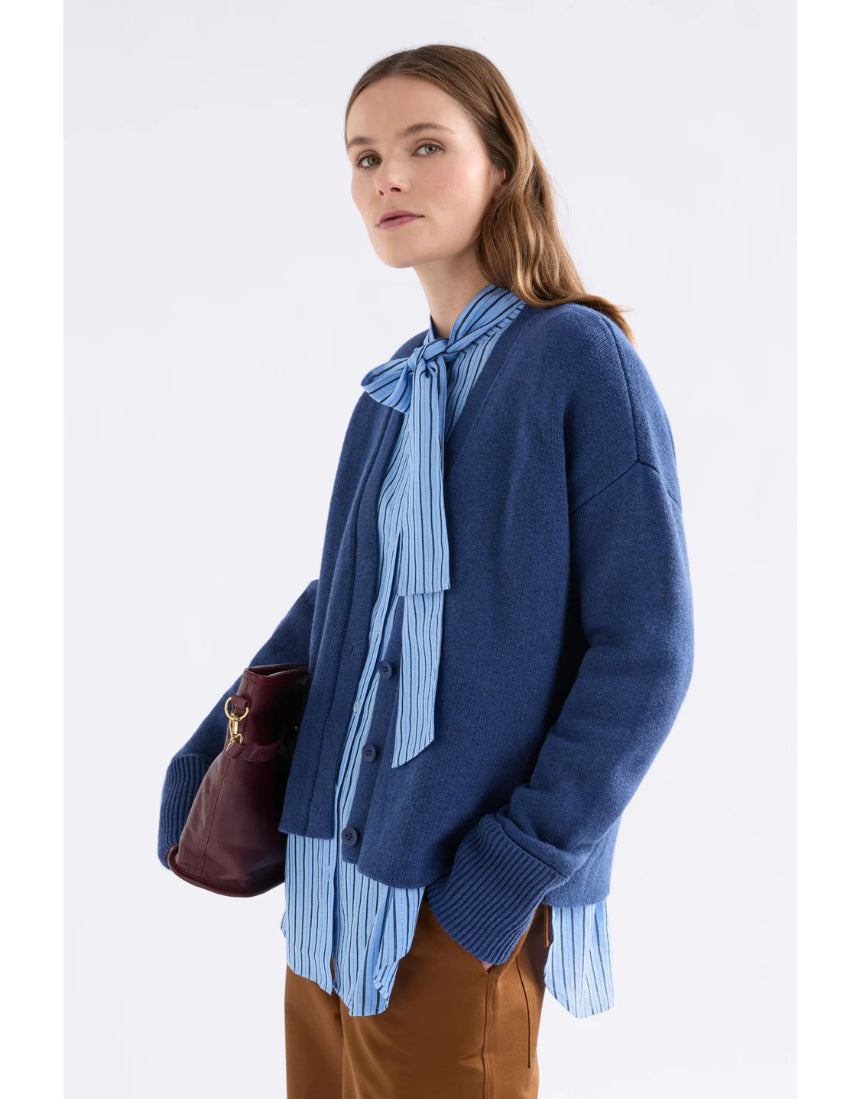 Elk Klee Cardi in bright navy, a stylish knitted clothing item with a textured pattern, shown on a model.