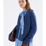 Elk Klee Cardi in bright navy, a stylish knitted clothing item with a textured pattern, shown on a model.