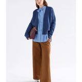 Elk Klee Cardi in bright navy, a cozy knitted cardigan with a textured pattern, displayed on a plain background.