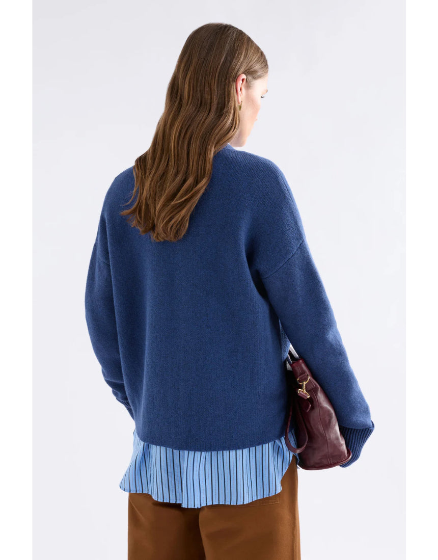 Elk Klee Cardi in bright navy, a cozy knitted clothing piece with a textured pattern and long sleeves.