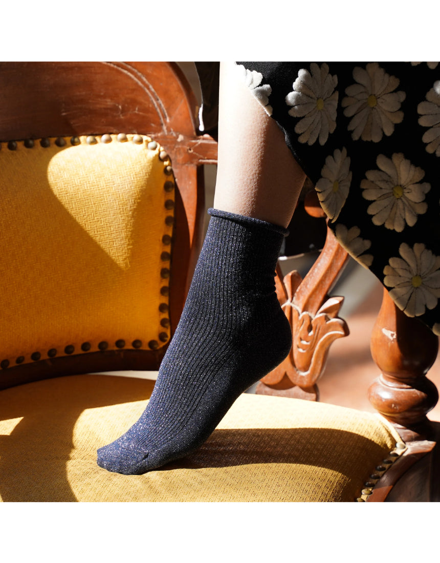 Blue glitter lurex socks by Klue, featuring a shiny, textured fabric with a comfortable sock design.