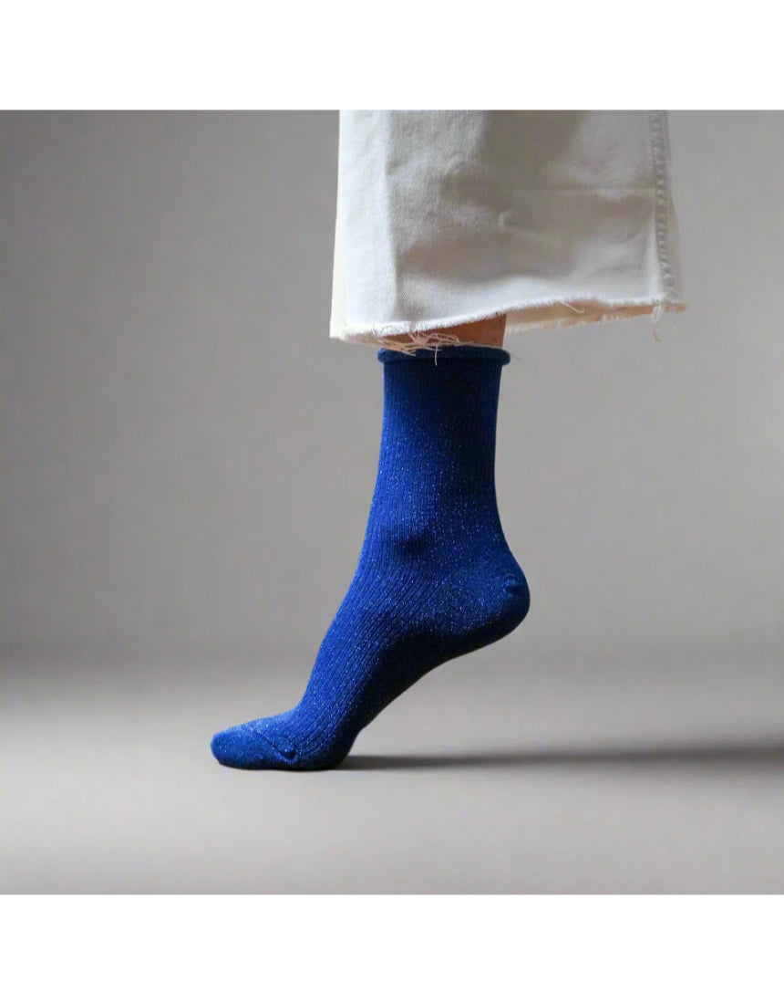 Electric blue glitter lurex socks by Klue featuring shiny, textured fabric and a comfortable fit for stylish casual wear.