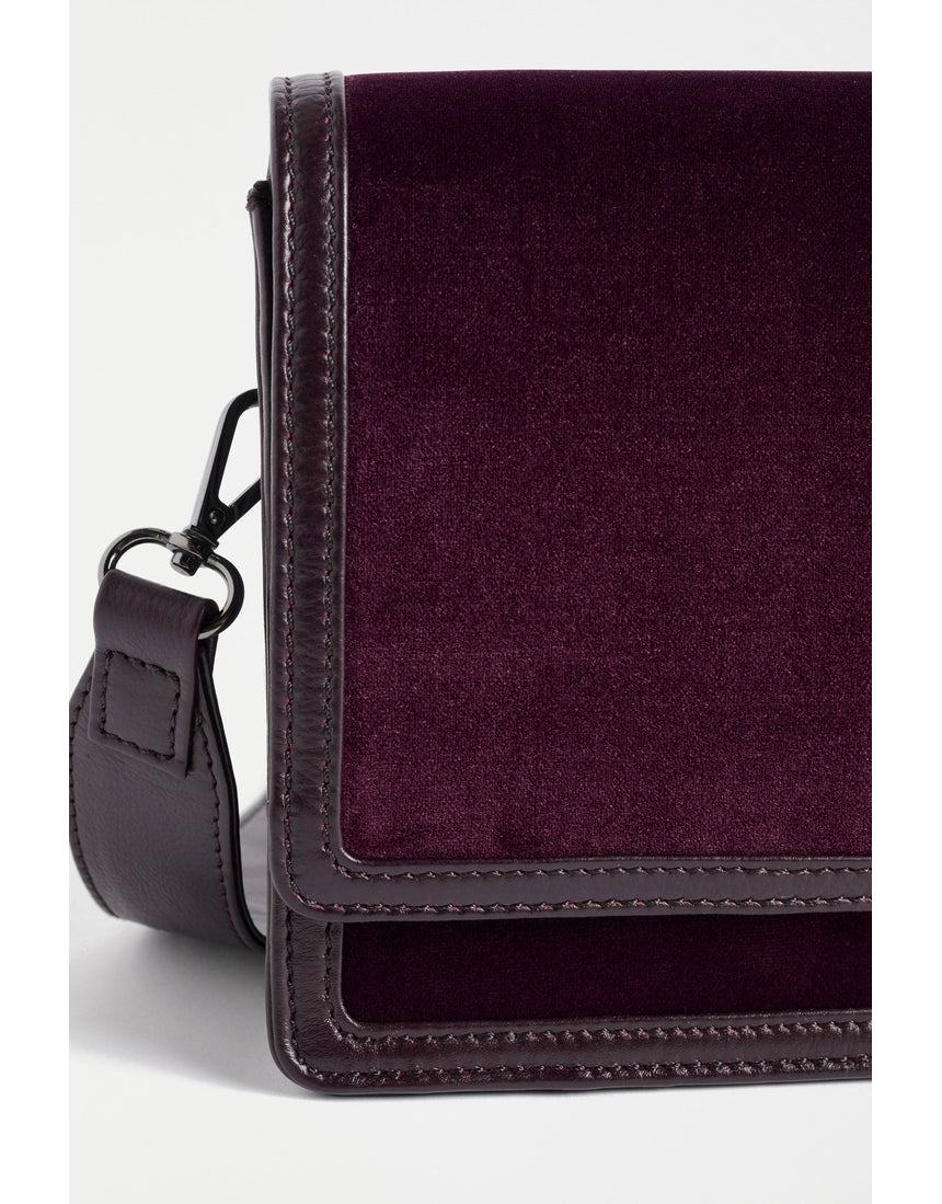 ELK The Label Vel Crossbody Bag in Mulberry leather, featuring a sleek design with adjustable strap and compact size.