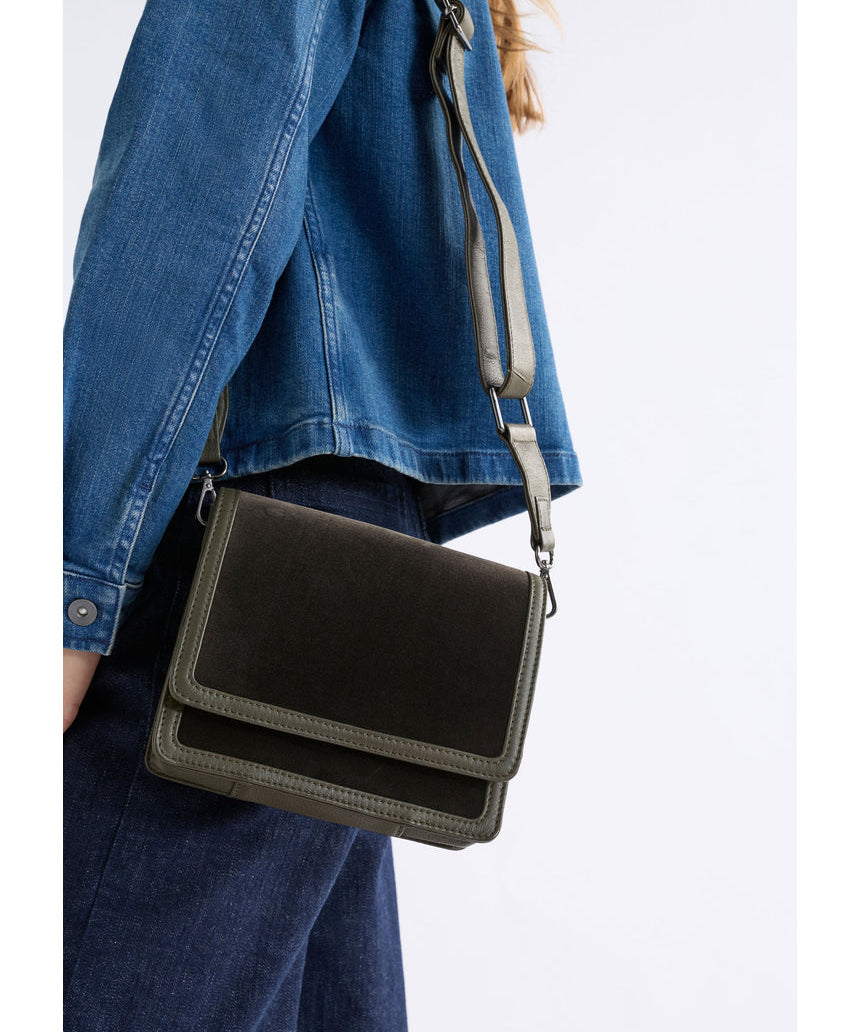 Dark olive ELK The Label Vel crossbody bag with sleek design, adjustable strap, and compact shape for everyday wear.