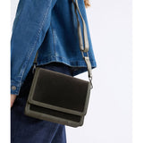 Dark olive ELK The Label Vel crossbody bag with sleek design, adjustable strap, and compact shape for everyday wear.