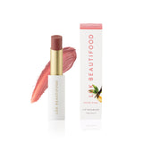 Luk Beautifood Lip Nourish lipstick in Nude Pink, showing the sleek tube and the soft pink shade inside.