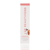 Luk Beautifood Lip Nourish lipstick in Tangerine Pomegranate with natural ingredients and vibrant orange packaging.