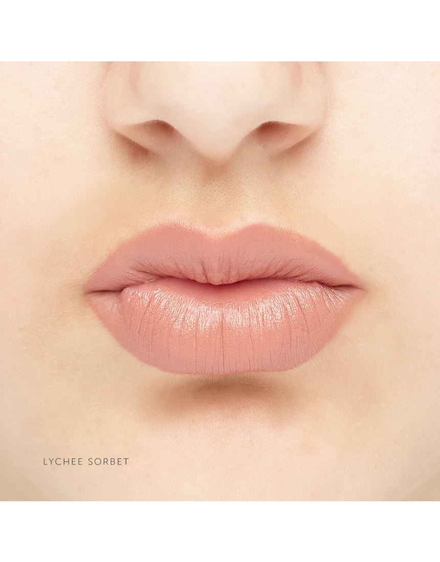 Luk Beautifood Natural Lipstick Crayon in Lychee Sorbet shade on lips, showcasing vibrant pink color and smooth application.