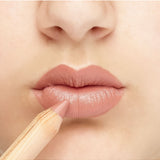 Luk Beautifood Natural Lipstick Crayon in Lychee Sorbet applied on lips, showcasing vibrant pinkish lip color.