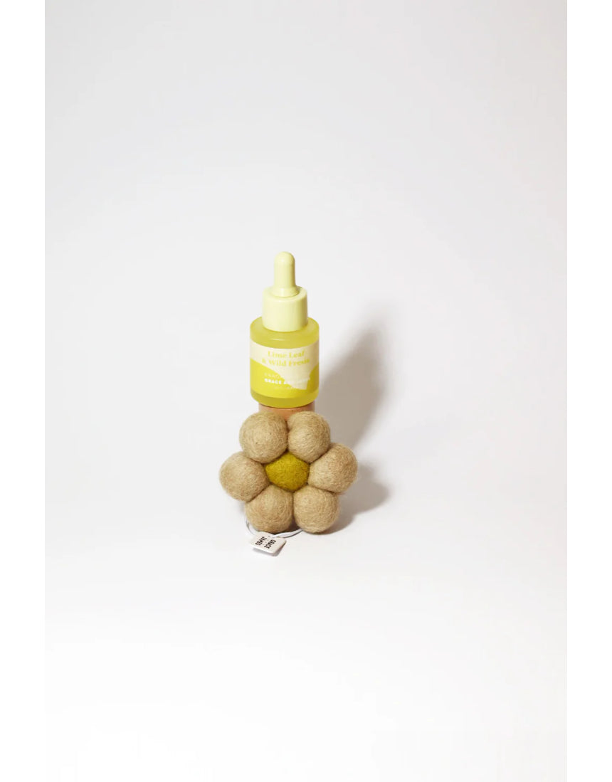 Grace & James Lime Leaf and Wild Fresia felt air freshener with lime and freesia floral design.