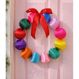 Colorful silk ball Christmas wreath by Little Fish Co featuring vibrant multi-colored silk balls for festive holiday decor.