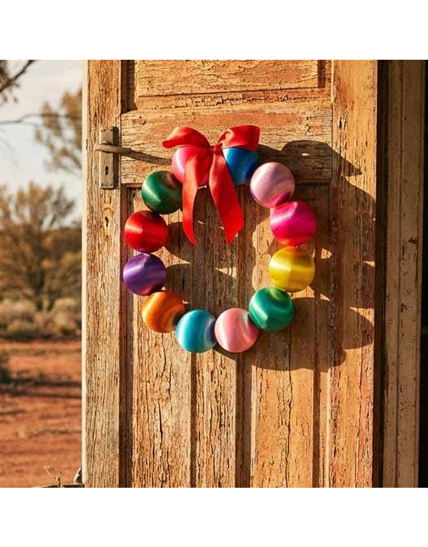Colorful Little Fish Co silk ball Christmas wreath with vibrant multi-colored silk balls, perfect for festive holiday decor.