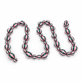 Green and pink satin stripe Christmas garland by Little Fish Co, featuring soft, shiny fabric strands for festive decoration.