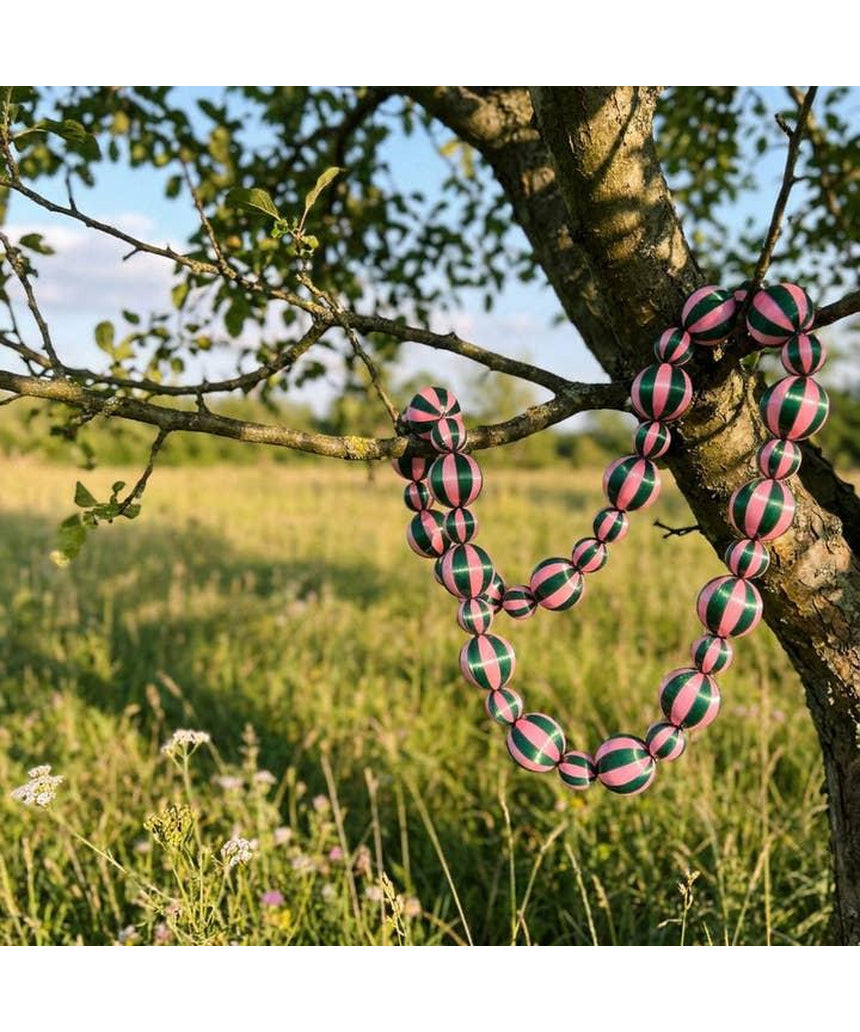 Green and pink satin Christmas garland by Little Fish Co with stripe pattern, displayed as a festive decorative element.