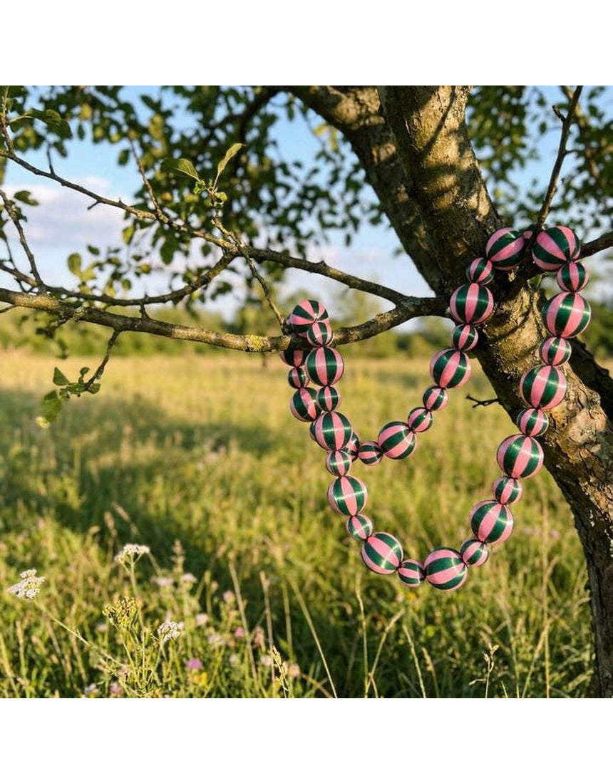 Green and pink satin Christmas garland by Little Fish Co with stripe pattern, displayed as a festive decorative element.