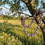 Green and pink satin Christmas garland by Little Fish Co with stripe pattern, displayed as a festive decorative element.