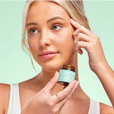 Lula Focus Balm, an essential oil product, displayed in a small jar with natural ingredients visible, designed for aromatherapy.