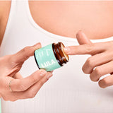Lula Focus Balm, an essential oil product with natural ingredients, displayed in a small jar with a wooden lid.