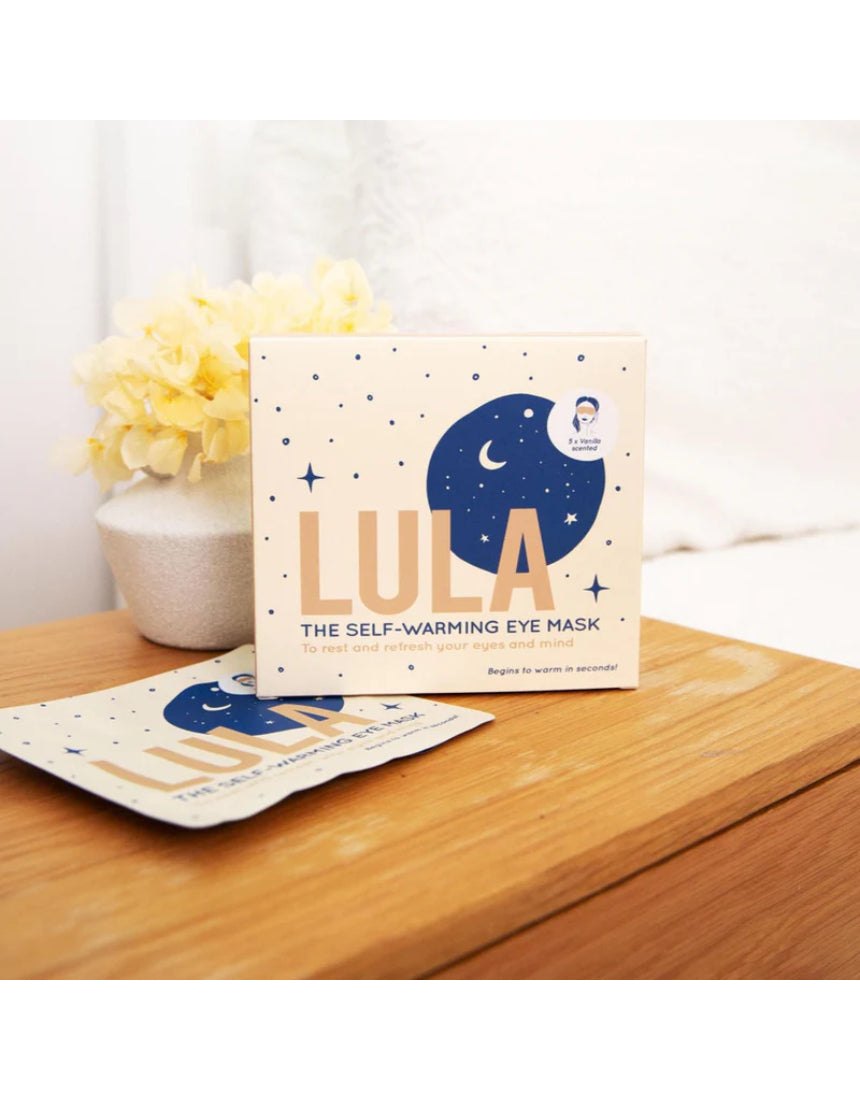 Lula self-warming eye mask in vanilla scent, shown in box with five masks, designed for relaxing eye comfort and warmth.