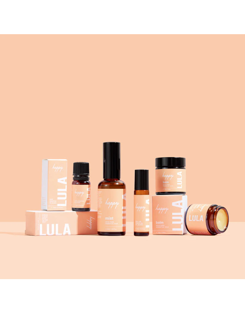 Lula Happy Mist essential oil bottle with a sleek design, featuring colorful floral illustrations on the label.