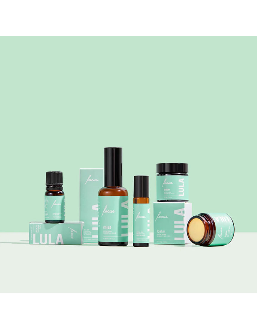Lula Focus Balm essential oil in a small glass bottle with a black cap, labeled with Lula branding and product details.