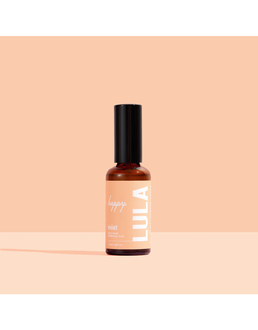 Lula Happy Mist essential oil bottle with a colorful label, showcasing a natural, calming aromatherapy product from Lula.