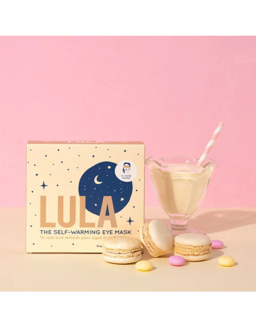 Lula self-warming eye mask in vanilla color, designed for relaxing eye comfort, shown in a lifestyle setting.