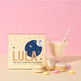 Lula self-warming eye mask in vanilla color, designed for relaxing eye comfort, shown in a lifestyle setting.