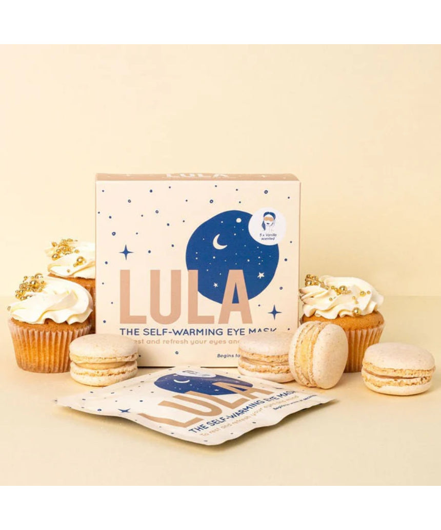 Lula self-warming vanilla eye mask on a person, showcasing a soft, comfortable fabric for relaxing eye comfort and sleep aid.