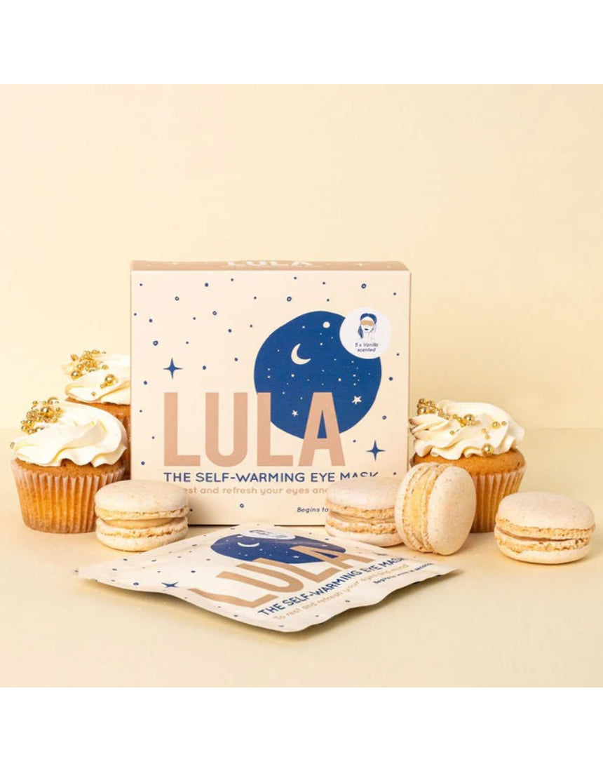 Lula self-warming vanilla eye mask on a person, showcasing a soft, comfortable fabric for relaxing eye comfort and sleep aid.
