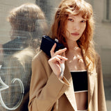 Model carrying the Anatole Colette navy blue micro-umbrella