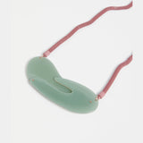 Elk Neve Jade Green Necklace featuring a vibrant green pendant and a delicate chain, stylish jewelry accessory.