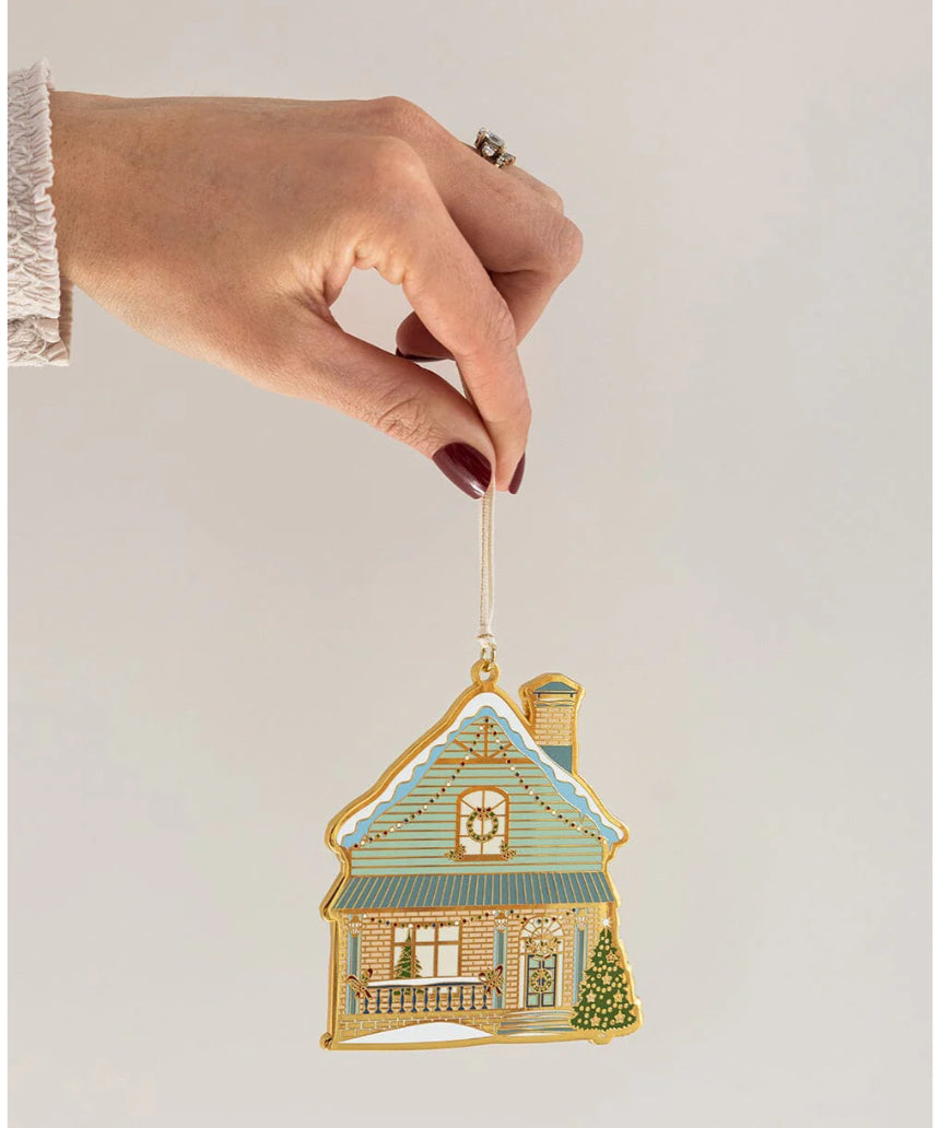 Bespoke Letterpress enamel Christmas ornament shaped like a house, festive holiday decoration with detailed colorful design.