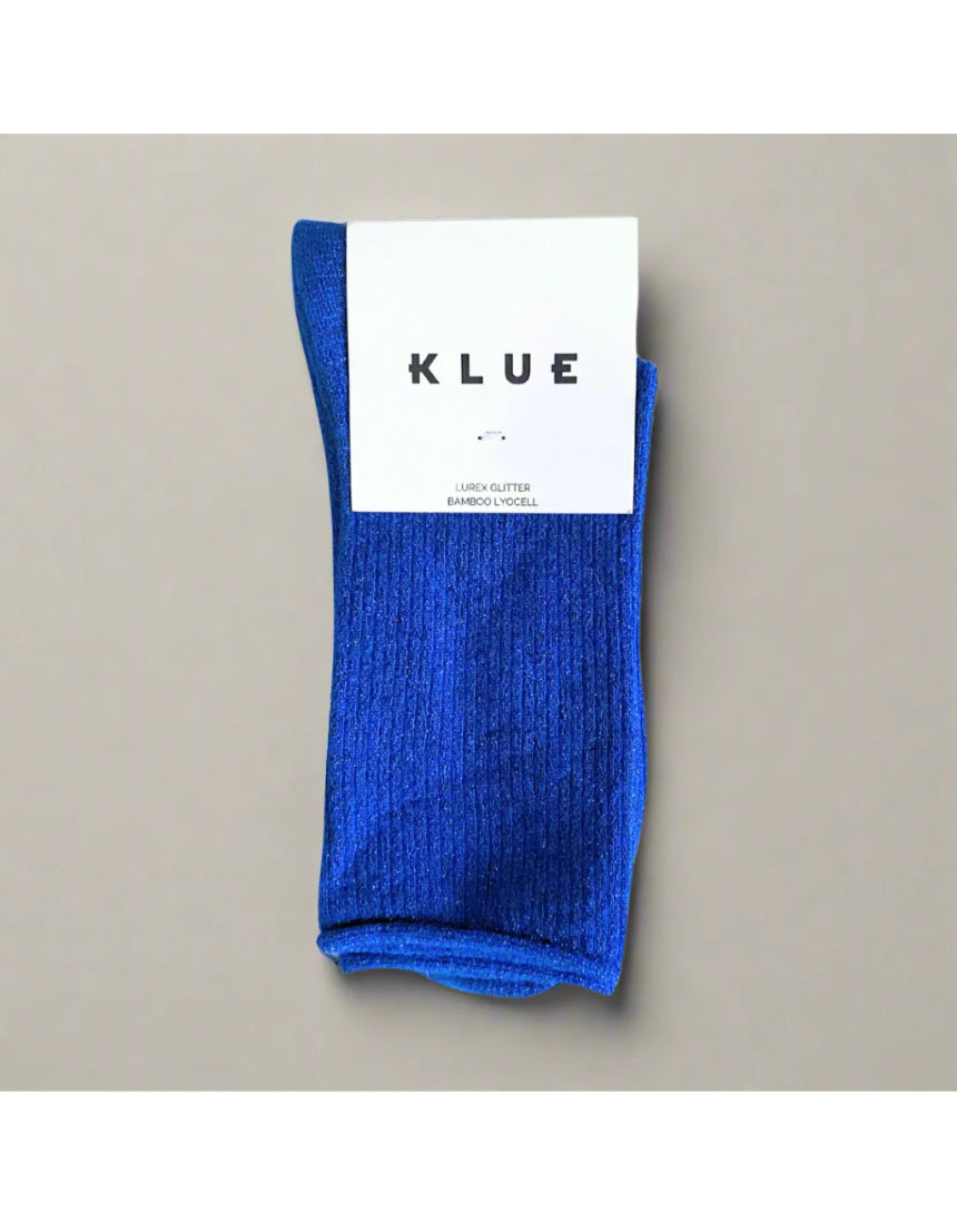 Bright electric blue glitter lurex socks by Klue, showcasing their shiny, textured fabric design in a stylish sock packshot.