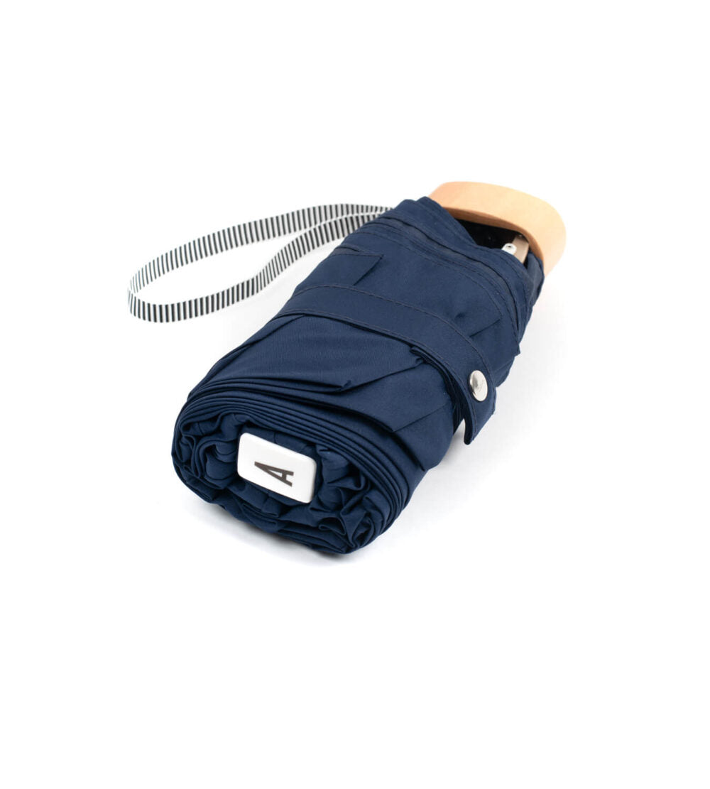 Anatole Colette folded navy blue micro-umbrella with timber handle