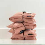 Salus Lavender & Barley heat pillow in blush, square-shaped bath and body product with soft pink fabric and plush texture.
