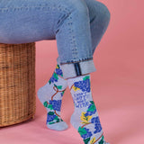 Blue Q ladies crew socks featuring a playful design and "Don't Not Want Wine" slogan, perfect for casual wear.