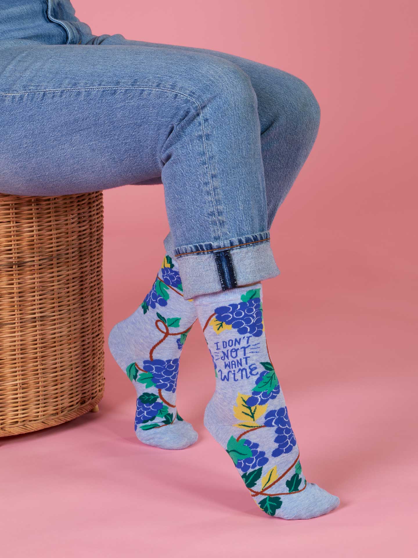 Blue Q ladies crew socks featuring a playful design and "Don't Not Want Wine" slogan, perfect for casual wear.