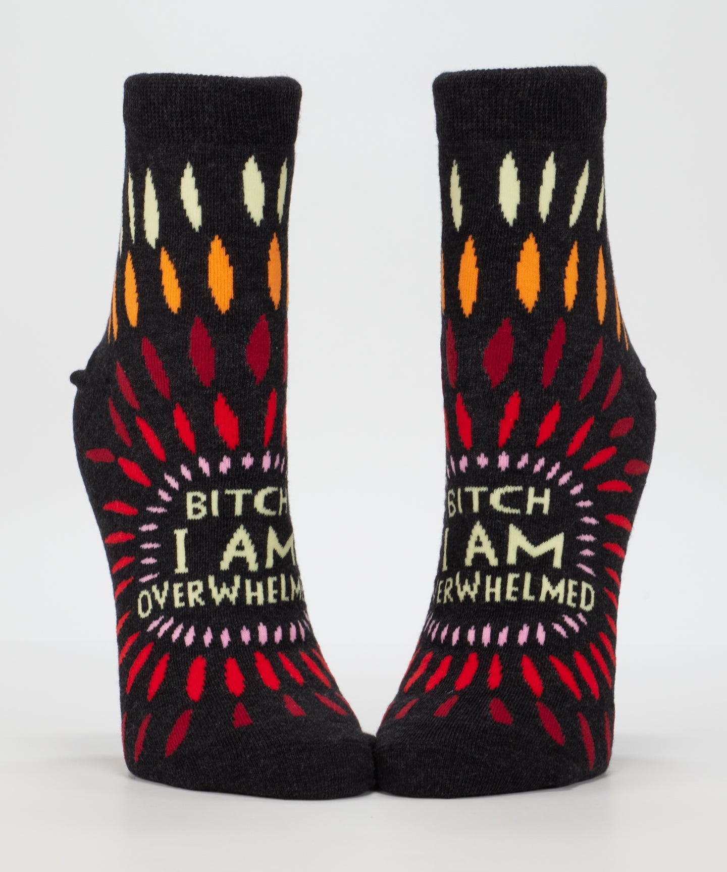 Blue Q ankle socks featuring a design with the phrase "Bitch I AM Overwhelmed" in bold lettering, casual and comfortable footwear.