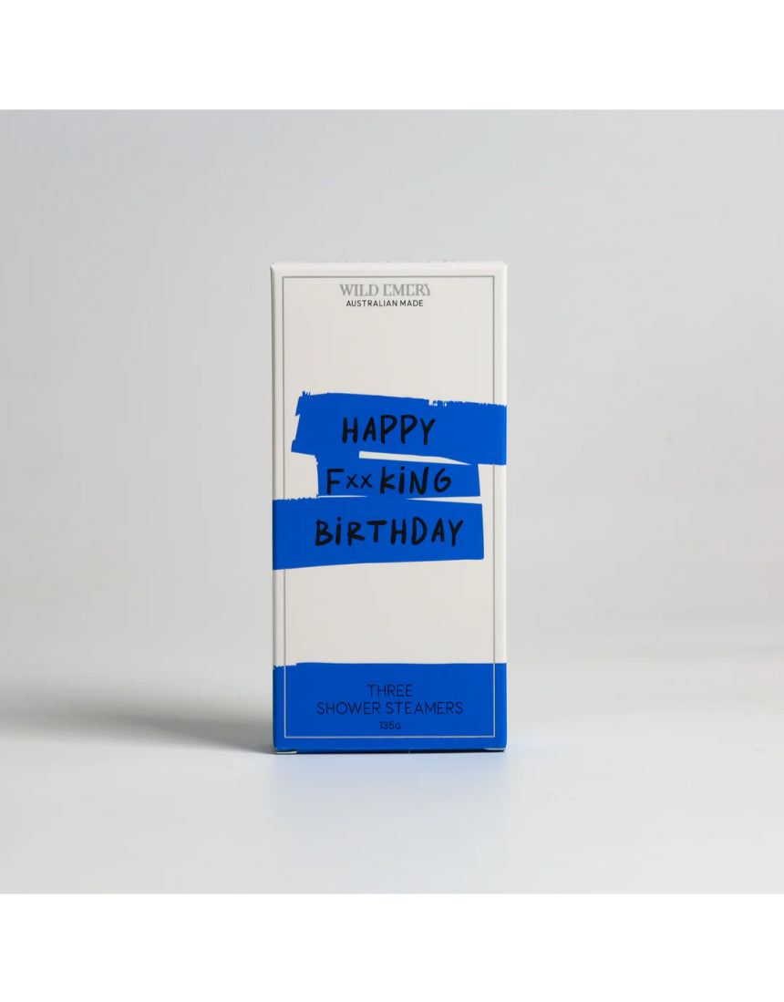 Wild Emery Happy F**king Birthday shower steamers in a 3-pack, featuring colorful bath and body product packaging.