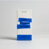 Wild Emery Happy F**king Birthday shower steamers in a 3-pack, featuring colorful bath and body product packaging.