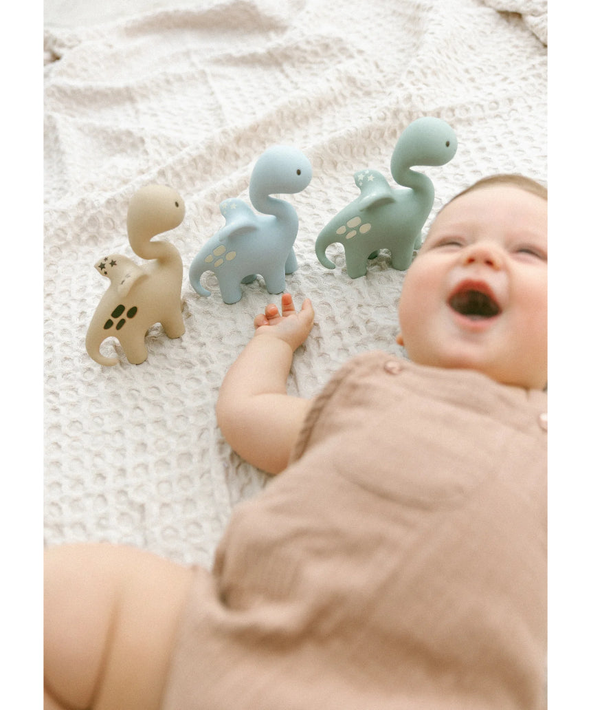 Blue Diplo the Dino-Dragon teether by Winnie Parkes, showcasing a playful dinosaur and dragon design on a soft blue teether.