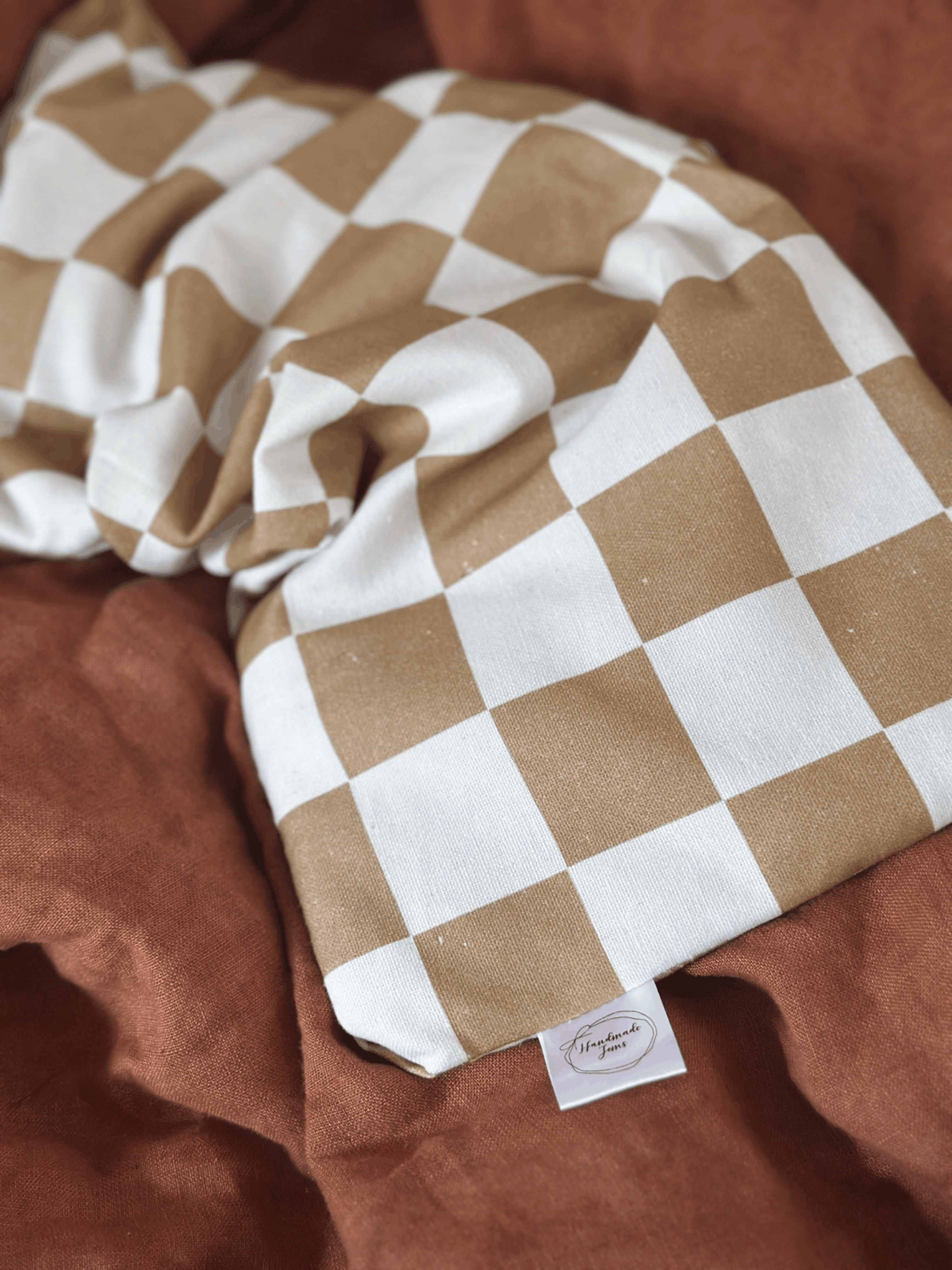 Beige check Lupin heat pack from Handmade Jems, soft fabric with a cozy, handmade design for warmth and comfort.