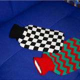 Casa Rolio hot water bottle with black cover, soft texture, and rounded shape for warmth and comfort.
