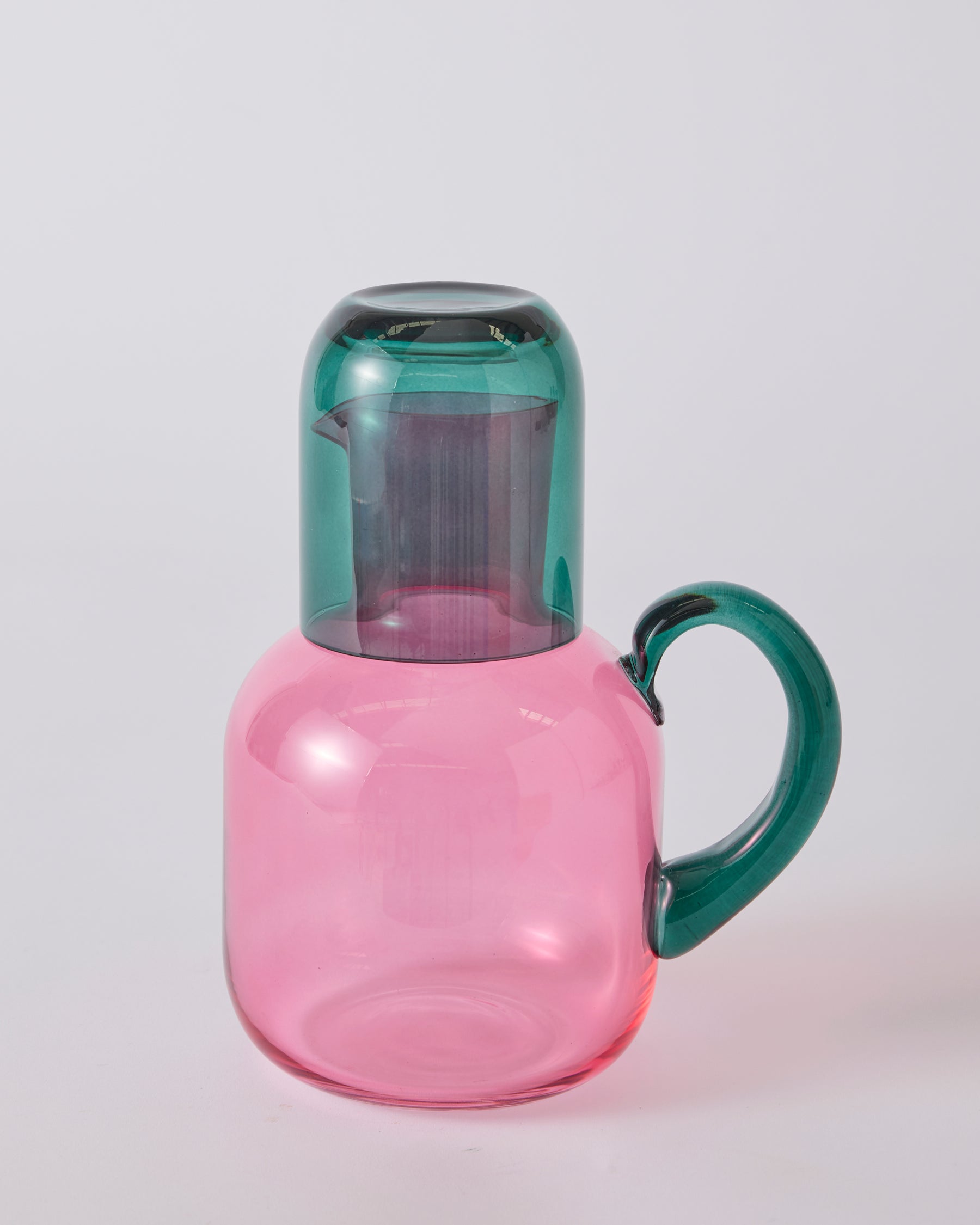 Kip & Co Isle of Pink glass carafe and matching glass set with pink and white design on clear glass.