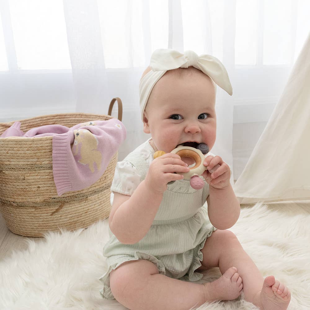 Living Textiles Multi-Surface Teething Wheel in Rose, soft multi-texture teething toy with colorful design for babies.
